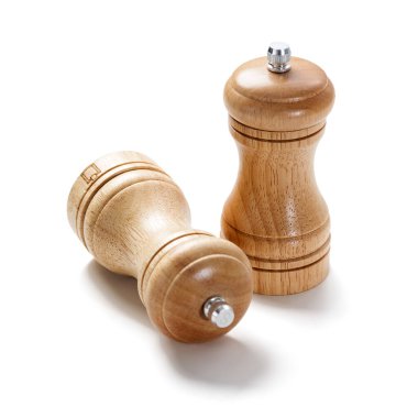 Wooden salt shaker and pepper mill isolated on white