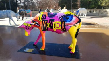 A cow sculpture painted with a design inspired by 