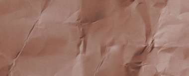 Buruşmuş kağıtlarla kaplanmış yaratıcı bir arka plan..