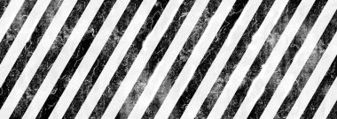 Çizgili arkaplanı olan uyarı işareti.