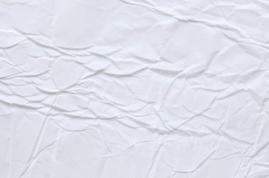 Buruşmuş kağıtlarla kaplanmış yaratıcı bir arka plan..