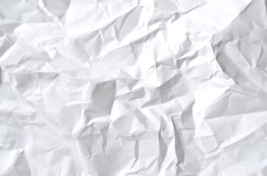 Buruşmuş kağıtlarla kaplanmış yaratıcı bir arka plan..