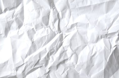 Buruşmuş kağıtlarla kaplanmış yaratıcı bir arka plan..