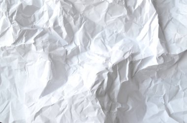 Buruşmuş kağıtlarla kaplanmış yaratıcı bir arka plan..