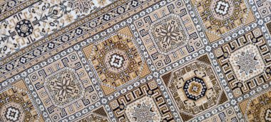 Local and authentic hand-knitted rug background.