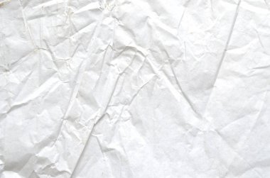 Buruşmuş kağıtlarla kaplanmış yaratıcı bir arka plan..