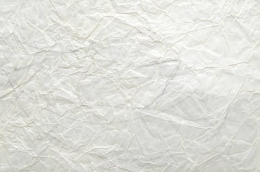 Buruşmuş kağıtlarla kaplanmış yaratıcı bir arka plan..