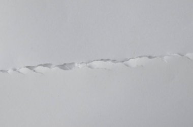 Buruşmuş kağıtlarla kaplanmış yaratıcı bir arka plan..