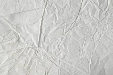 Buruşmuş kağıtlarla kaplanmış yaratıcı bir arka plan..