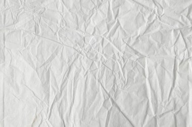 Buruşmuş kağıtlarla kaplanmış yaratıcı bir arka plan..