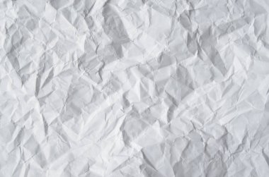 Buruşmuş kağıtlarla kaplanmış yaratıcı bir arka plan..