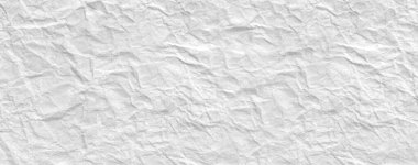 Buruşmuş kağıtlarla kaplanmış yaratıcı bir arka plan..