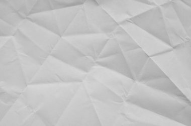 Buruşmuş kağıtlarla kaplanmış yaratıcı bir arka plan..