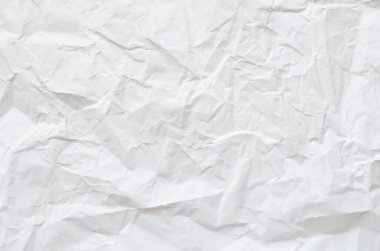 Buruşmuş kağıtlarla kaplanmış yaratıcı bir arka plan..