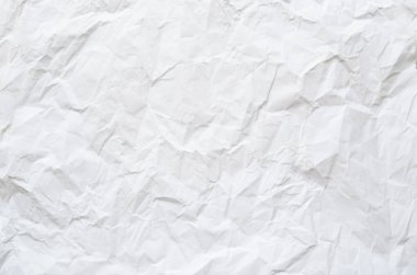 Buruşmuş kağıtlarla kaplanmış yaratıcı bir arka plan..