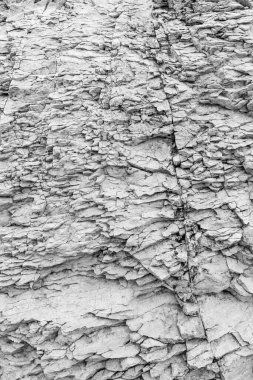 Siyah beyaz taş dokusunun fotoğrafı. Gri doğal kaya. Arka plan için mükemmel.