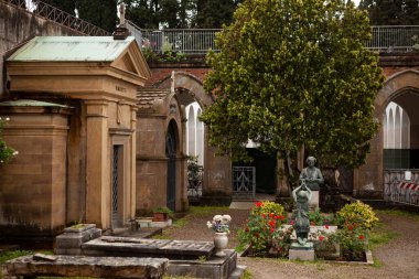 FLORENCE, ITALY-MARCH 27 2024:Cimitero delle Porte Sante (The Sacred Doors Cemetery)is a monumental cemetery in Florence located within the fortified bastion of the Basilica of San Miniato al Monte clipart