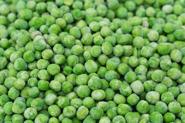 group of frozen green peas closeup selective focus
