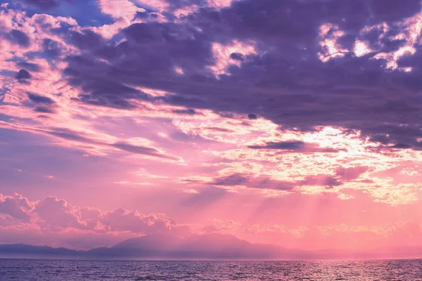 Seascape in the evening during sunset. Mount Olympus on the horizon. Aegean Sea in Halkidiki, Greece, Europe