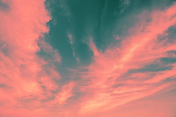 Pink green cloudy sky at sunset. Sky texture. Abstract nature background