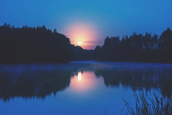 Magical dawn over the lake. Serene lake in the early morning. Nature landscape
