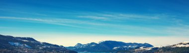 View of the mountains around Serre Poncon lake in winter. Hautes Alpes, France. Horizontal banner clipart