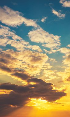 Colorful cloudy sky at sunset. Gradient color. Sky texture. Abstract nature background. Vertical banner