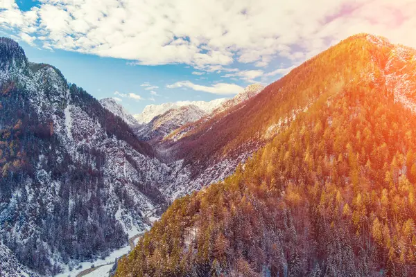 stock image Mountain valley with the Pisnica river in winter. The tops of the mountains are covered with snow. View of the Alps in Kranjska Gora at dawn. Triglav National Park. Slovenia