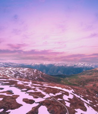 Aerial view of snow-covered mountain in summer. High mountain road Bjorgavegen. Aurlandsvegen, Aurland, Norway clipart