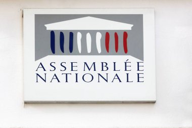 Bourg-en-Bresse, France - October 4, 2023: National assembly in France symbol on wall of a parliamentary permanence clipart