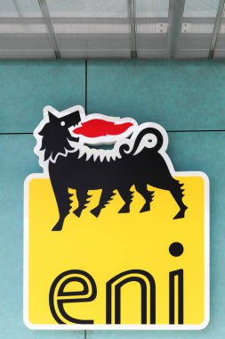 Mionnay, France - September 20, 2019: ENI logo on a wall. ENI is an italian oil company headquartered in Roma, Italy. Considered one of the global supermajors, it has operations in 79 countries clipart