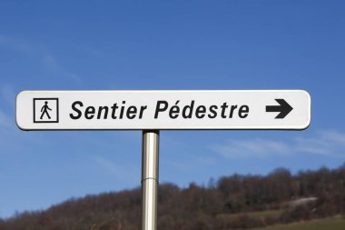 Walking trail signpost called sentier pedestre in French language