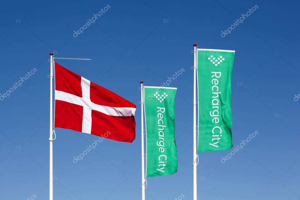 Horsens, Denmark - March 15, 2025: Recharge City logo on flags. Recharge City becomes the first and largest parking and recharging center with EU platin certification placed in the heart of Denmark