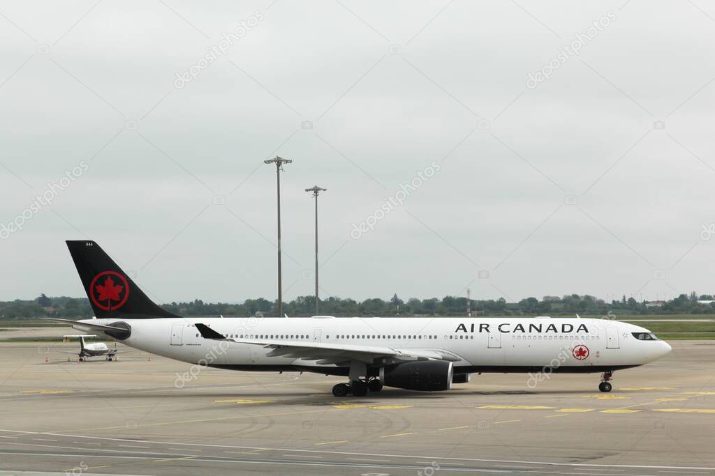 Colombier-Saugnieu, France - April 30, 2024: Air Canada aircraft at Lyon airport. Air Canada is the flag carrier and largest airline of Canada by fleet size and passengers carried