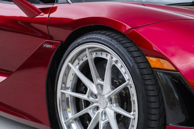 Miami, Florida USA - February 20, 2022: Close up view of a McLaren 720s supercar on display at the public Miami Concours car show in the upscale Design District