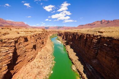 The historic Colorado River flows through Marble Canyon in Arizona clipart