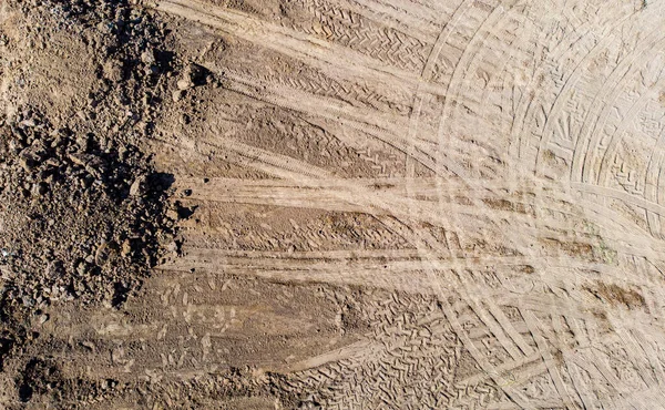 Wheel tracks on dirt. tractor tracks,