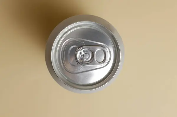 Aluminum can with a drink on a light background. Alcoholic and non-alcoholic drinks. Horizontal orientation. Top view.