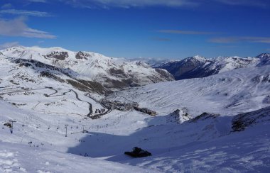 Grandvalira, Andorra, December 6, 2022: a snow groomer in a ski resort in Andorra.