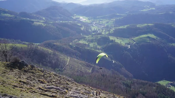 Monte Ernio, Gipuzkoa, Basque Country, Spain, January, 03, 2023: Paragliding on the slopes of Monte Ernio