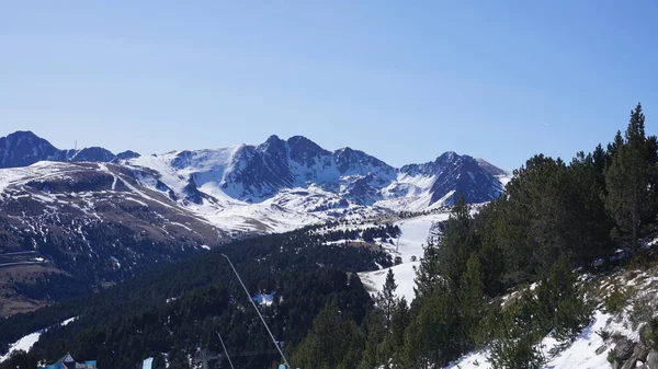 Snow and ski mountain landscape of the Pyrenees in Andorra a sunny spring day