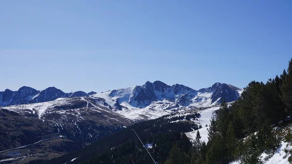 Snow and ski mountain landscape of the Pyrenees in Andorra a sunny spring day