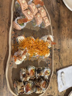 Acevichado Roll (Tempered Shrimp, Avocado, Topped with Sea Bass, Acevichada Sauce, Çıtır Tatlı Patates)