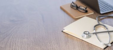 Medical  healthcare  network on Computing electronic medical record. Doctor working an Laptop with Stethoscope
