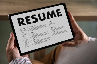 Businessmen Reading Resumes for a new job use laptops and CVs in the office. Applicant searching for new work Human resource interview, work resume, document resource