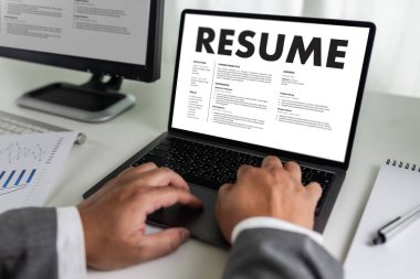 Businessmen Reading Resumes for a new job use laptops and CVs in the office. Applicant searching for new work Human resource interview, work resume, document resource