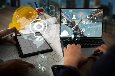Mühendis mimar sektörü 4. 0 tablet inşaat sahası, sanayi ve yenilik bilgilerini kullanarak fütüristik mimari kontrol yenilikçi güvenlik tasarımı inşaatında kullanmaktadır.