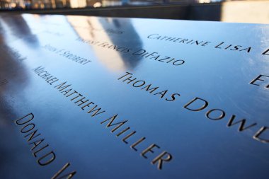 New York (United States), March 22, 2024. Remembrance of September 11. Commemorative plaque with the names of the victims of the September 11 attacks. clipart