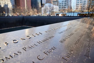 New York (United States), March 22, 2024. Remembrance of September 11. Commemorative plaque with the names of the victims of the September 11 attacks. clipart