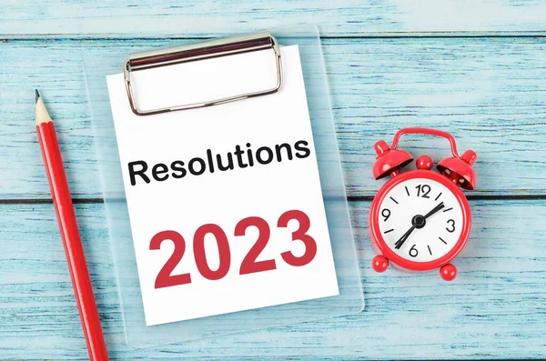 2023 Resolution; Goal and Target Setting List for 2023 year with alarm clock. Change and determination concept.